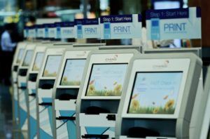 ST11082015-1522337892/ kasia12/ Matthias Ho SIA is rolling out a whole slew of self-check in kiosks at the departure counters in Changi Airport T2. Passengers can process their own boarding through the kiosks and proceed to counters to drop off their baggage. Other services like amending personal details and choosing of seats are also available on the kiosk system. // Photo by Matthias Ho for The Straits Times