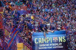 Barcelonas-players-celebrate-from-an-open-top-bus