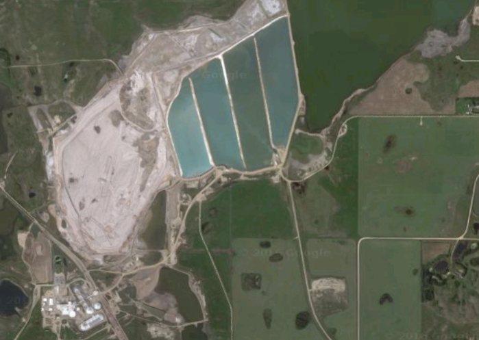 An aerial view of tailing ponds (top middle) at PotashCorp's Patience Lake, Saskatchewan mine. Source: Google Maps