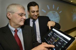 Exhibit 2: Dr. Mark Kris (MSK) and Manoj Saxena (IBM) looking onto 2013 version of Watson for Oncology app
