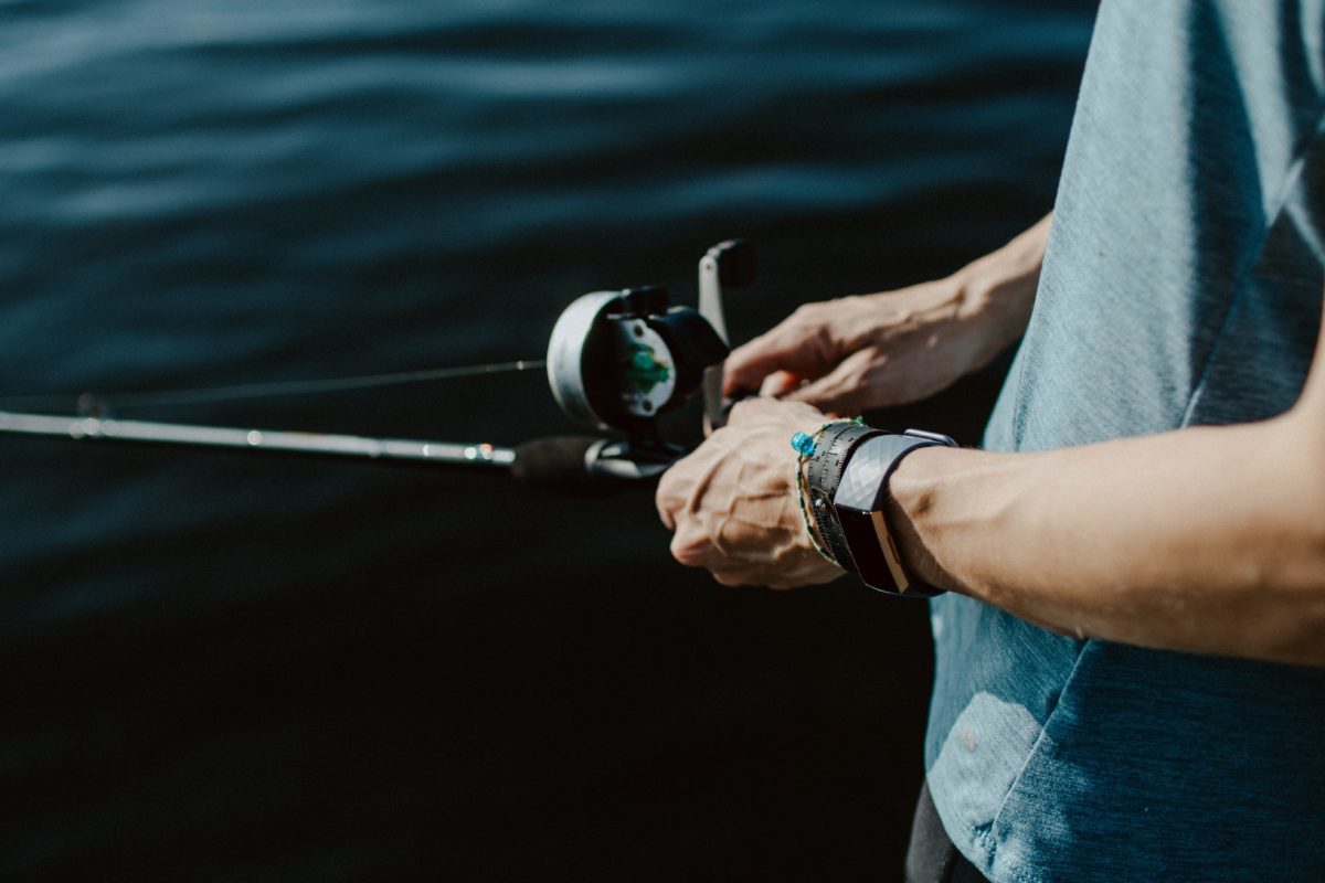 Man fishing with fitbit