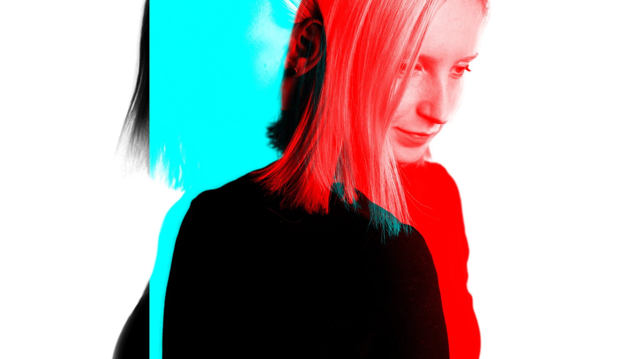 A double exposure image of a woman in red and blue